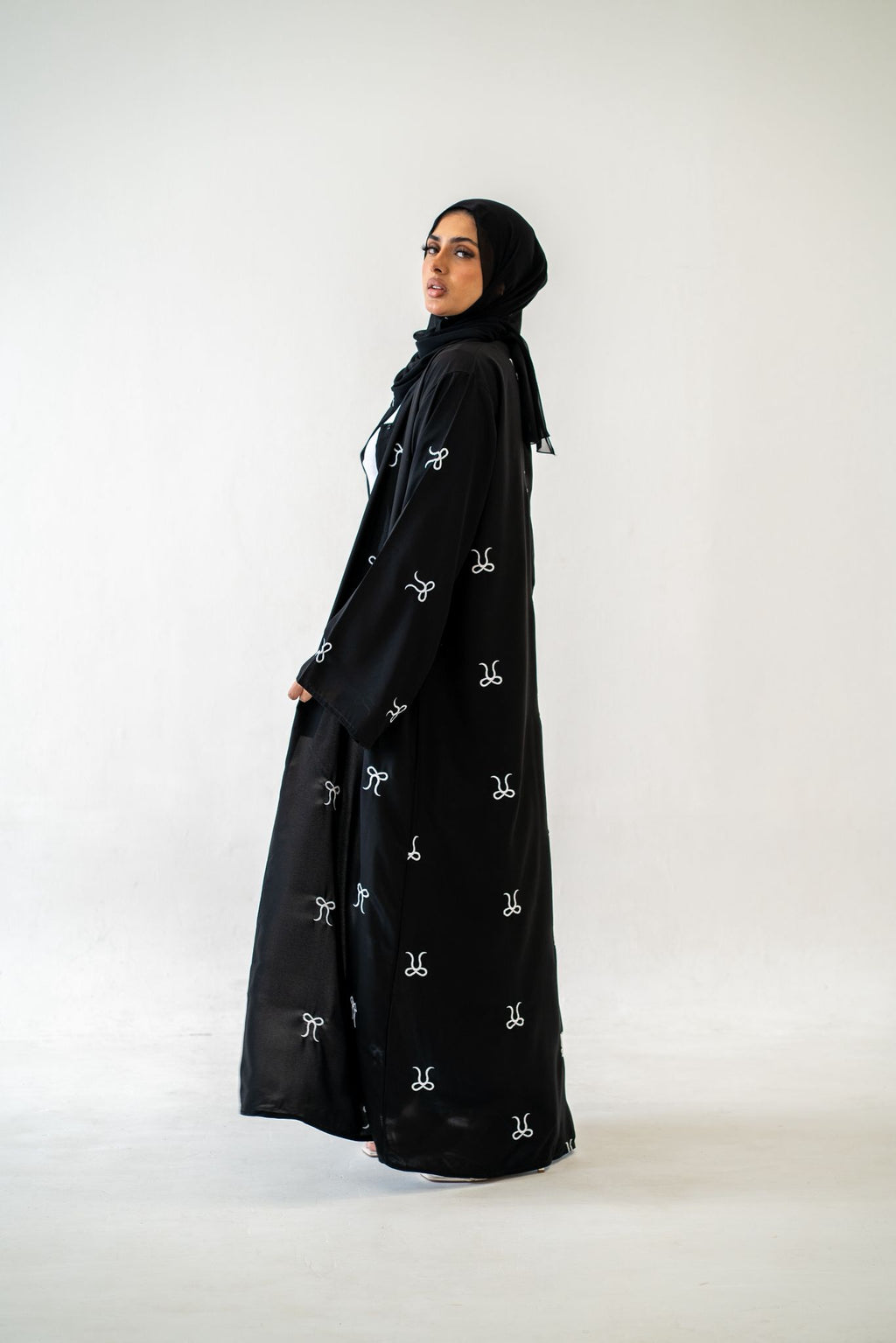 Close‑up of bow detail on Black Button Abaya with Bow Detail
