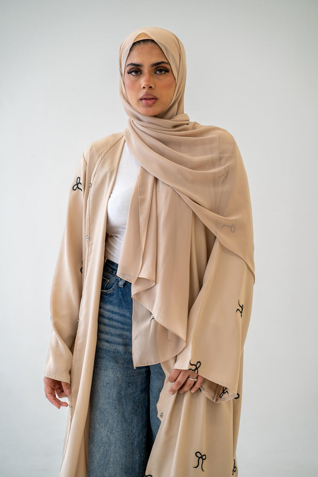 Side view of Black Button Abaya with Bow Detail